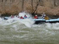 image showing a boat going through rapids